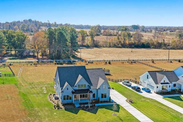 birds eye view of property with a rural view