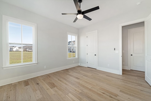 unfurnished bedroom featuring ceiling fan and light hardwood / wood-style flooring