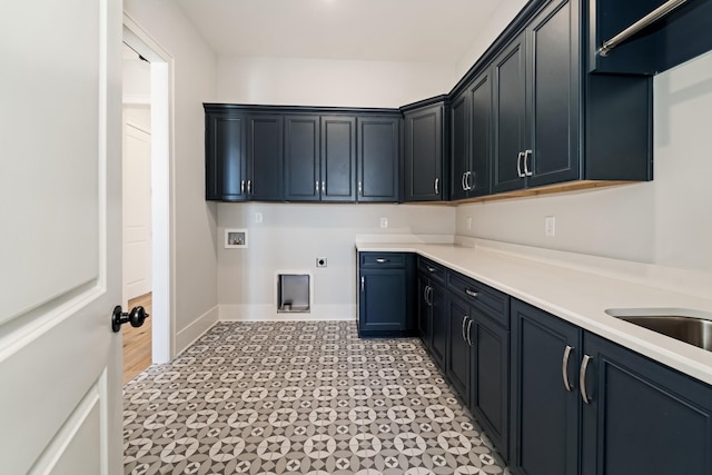 washroom featuring washer hookup, electric dryer hookup, and cabinets