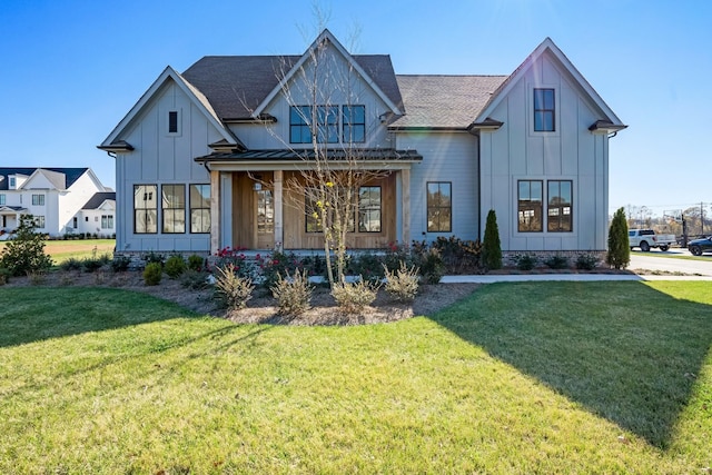 modern inspired farmhouse with a front yard and a porch