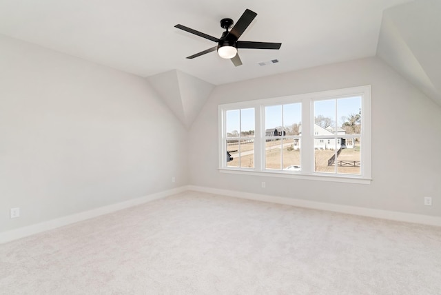 additional living space with vaulted ceiling, ceiling fan, and carpet