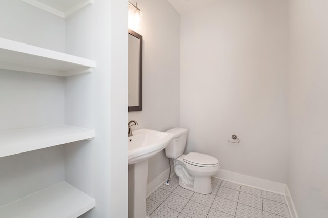 bathroom with sink and toilet