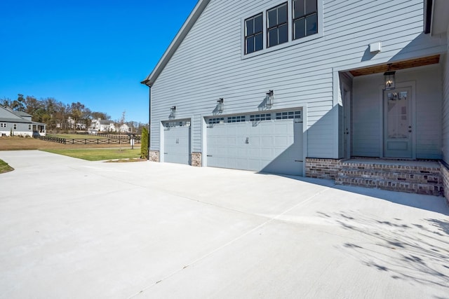 view of side of home with a garage