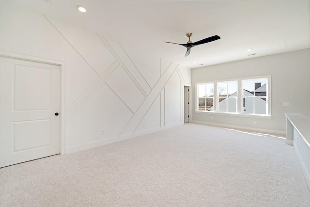 interior space with ceiling fan and carpet floors