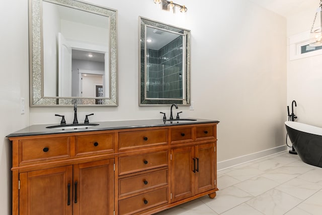 bathroom featuring a washtub and vanity