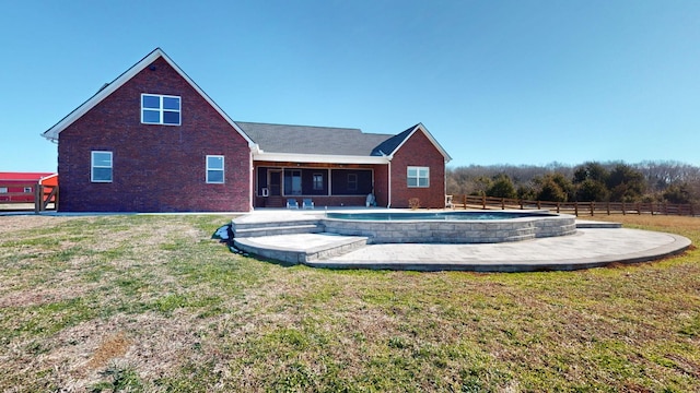 rear view of property with a yard