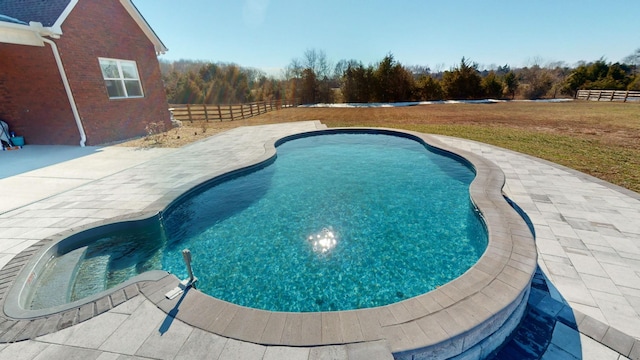 view of swimming pool featuring a patio