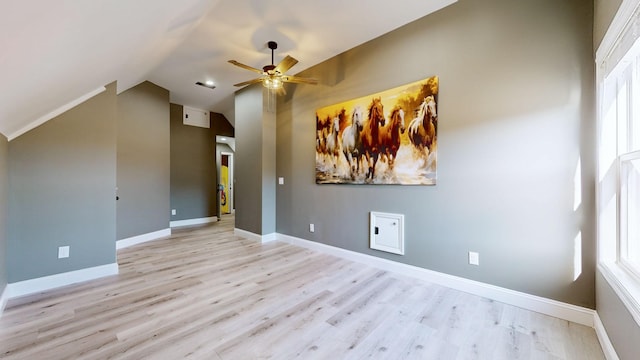 unfurnished room with ceiling fan, lofted ceiling, and light hardwood / wood-style flooring