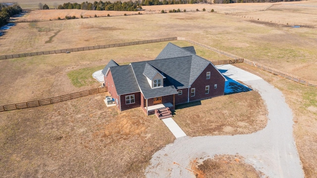 birds eye view of property featuring a rural view