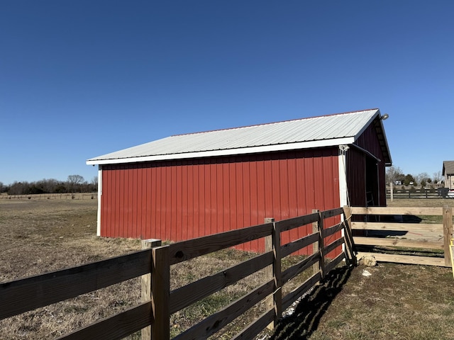 view of outdoor structure with a rural view