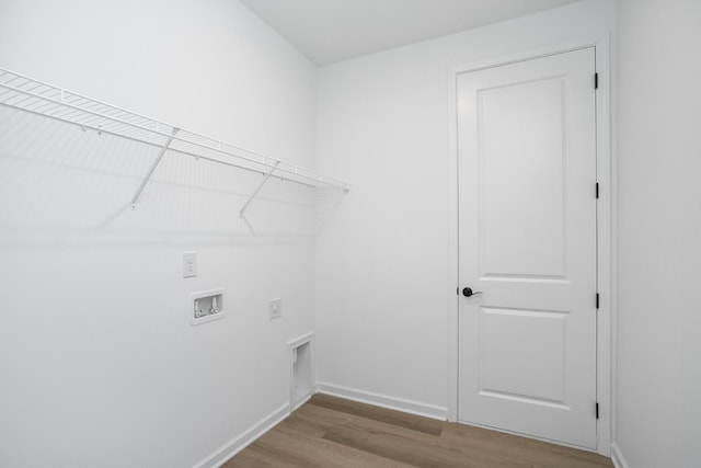 laundry area with washer hookup, light wood-type flooring, and hookup for an electric dryer