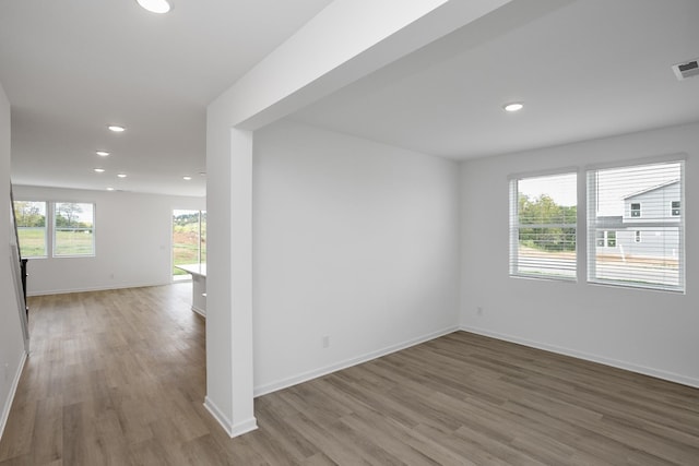 unfurnished room featuring hardwood / wood-style flooring