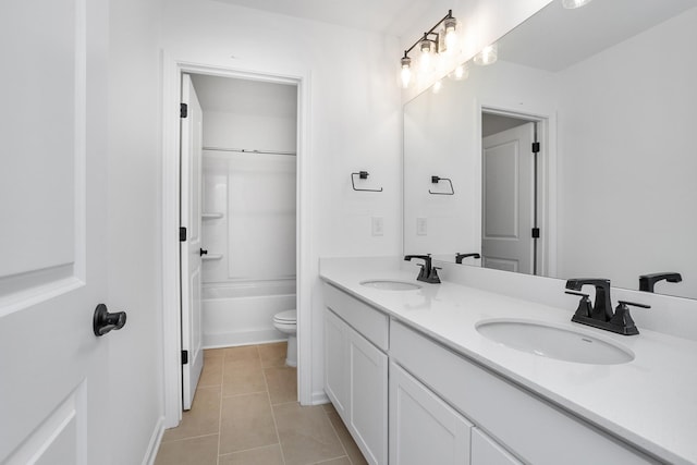 full bathroom with vanity, shower / washtub combination, tile patterned floors, and toilet