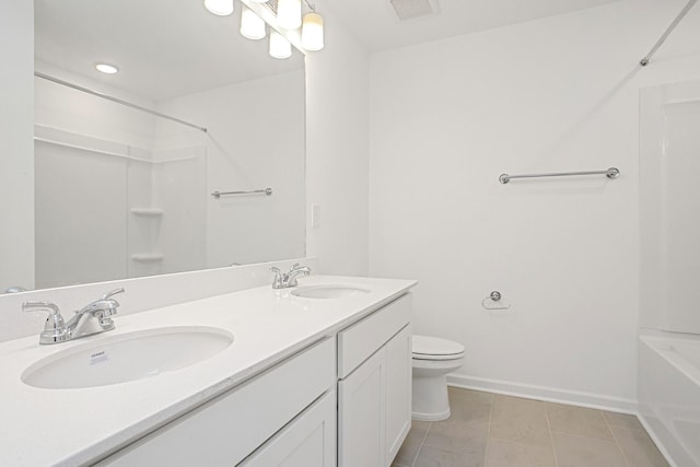 full bathroom with shower / bathing tub combination, toilet, vanity, and tile patterned flooring