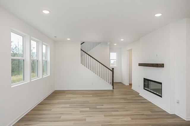 unfurnished living room featuring light hardwood / wood-style floors