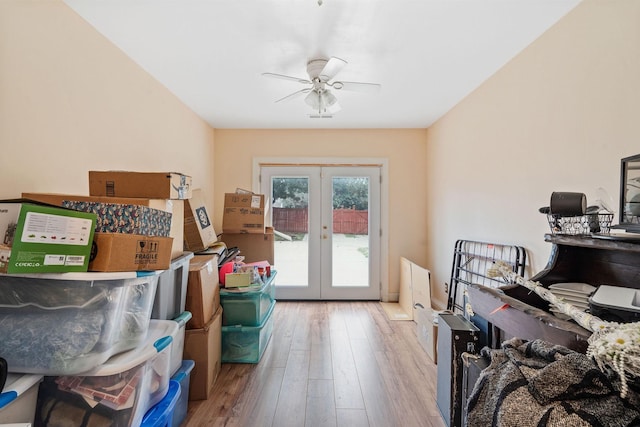 storage area with french doors and ceiling fan