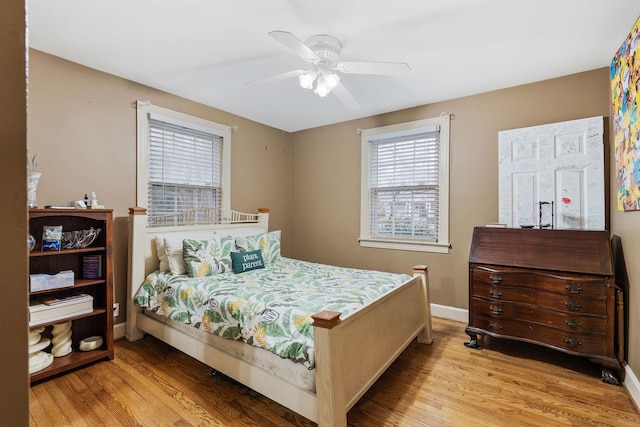 bedroom featuring ceiling fan and light hardwood / wood-style flooring