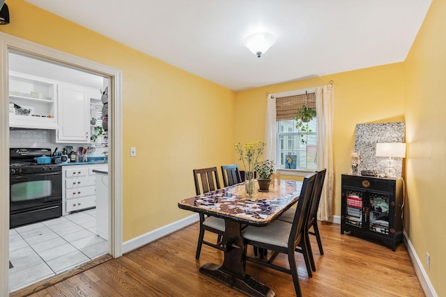 dining room with light hardwood / wood-style flooring