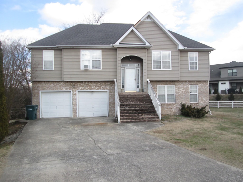 split foyer home featuring a garage