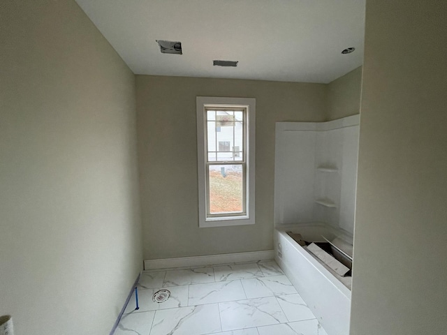 full bath with marble finish floor, baseboards, and shower / bathtub combination