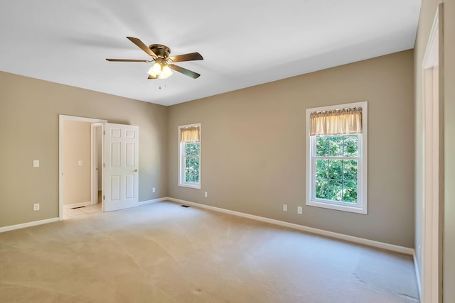 carpeted empty room with ceiling fan