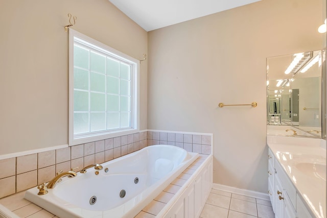 bathroom featuring vanity, tile patterned floors, and a relaxing tiled tub