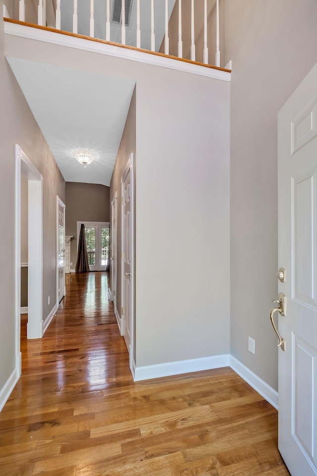 entryway with hardwood / wood-style flooring