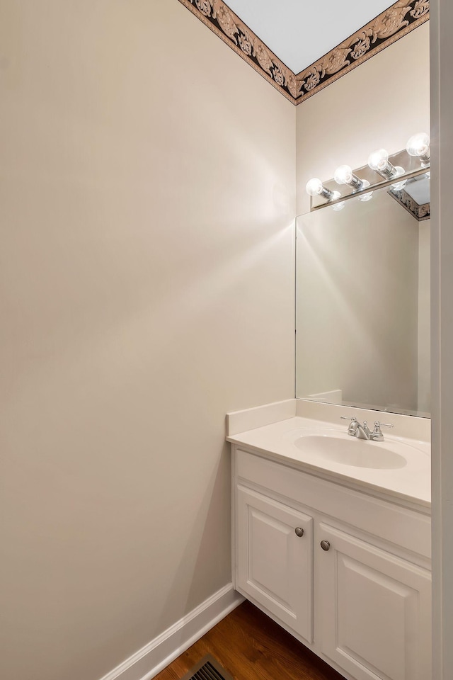 bathroom featuring vanity and hardwood / wood-style flooring