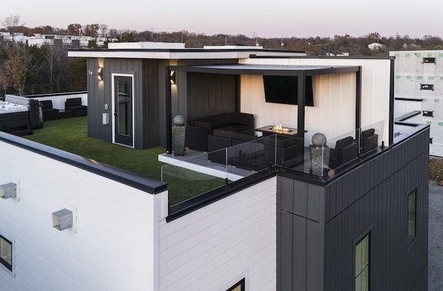 exterior space with a lawn and outdoor lounge area