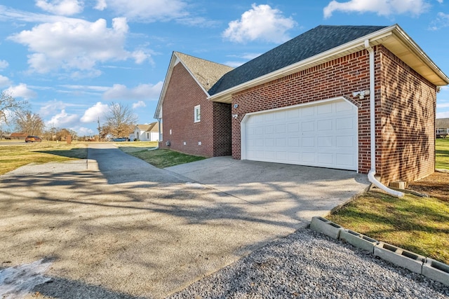 view of side of home featuring a garage