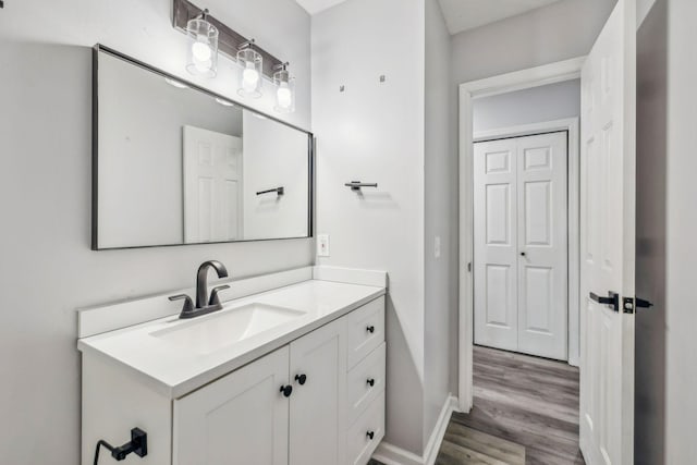 bathroom featuring vanity and hardwood / wood-style floors