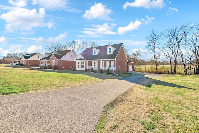 3000 Sam Davis Rd, Smyrna, TN 37167 - cape cod home featuring concrete driveway, brick siding, and a front yard