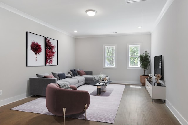 living room with crown molding and hardwood / wood-style floors