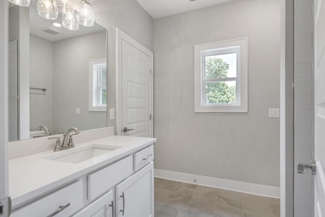 bathroom with vanity and tile patterned floors