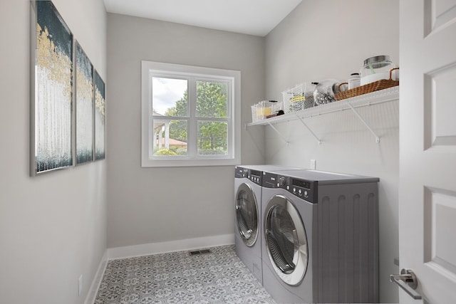 washroom with independent washer and dryer