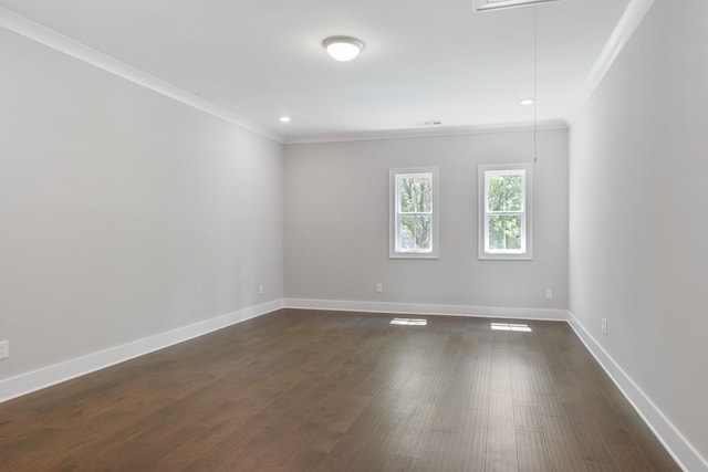 unfurnished room with dark wood-type flooring and ornamental molding