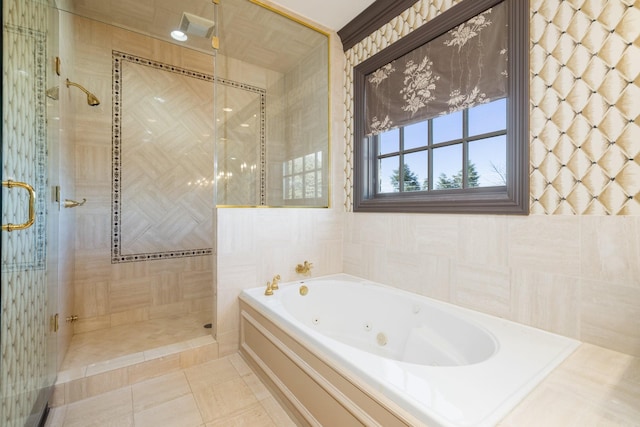 bathroom featuring independent shower and bath and tile patterned flooring