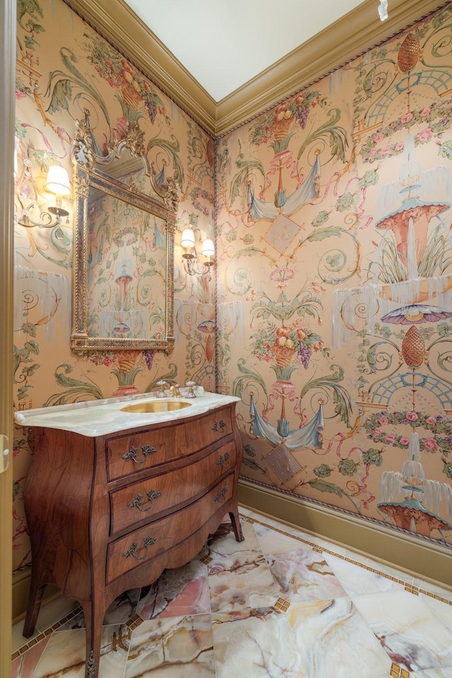 bathroom with ornamental molding and vanity