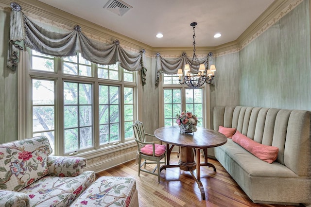 dining room featuring a chandelier and wood-type flooring