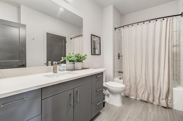 full bathroom featuring vanity, toilet, and shower / bath combo with shower curtain