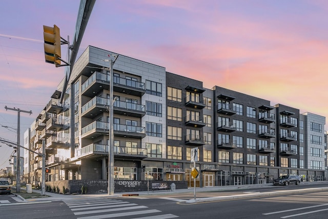 view of outdoor building at dusk