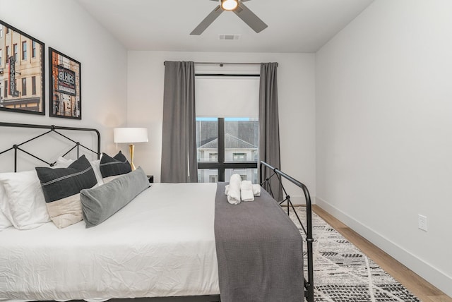 bedroom featuring ceiling fan and wood-type flooring