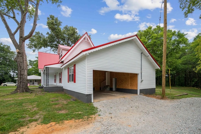 view of side of home featuring a lawn