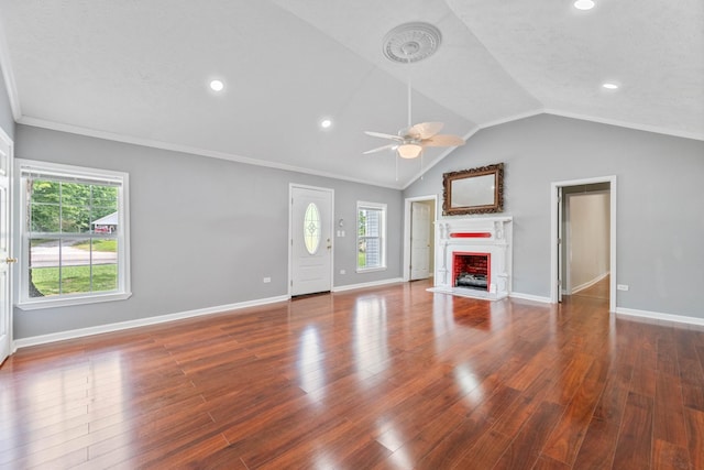 unfurnished living room with ceiling fan, ornamental molding, lofted ceiling, and dark hardwood / wood-style floors