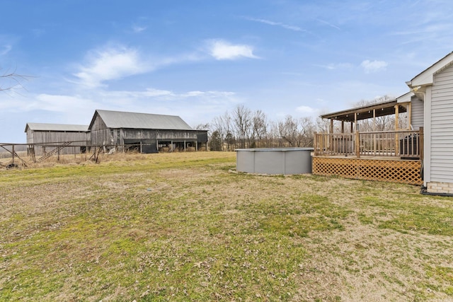 view of yard featuring a pool side deck