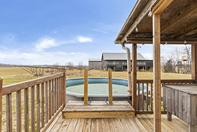 wooden deck featuring a rural view