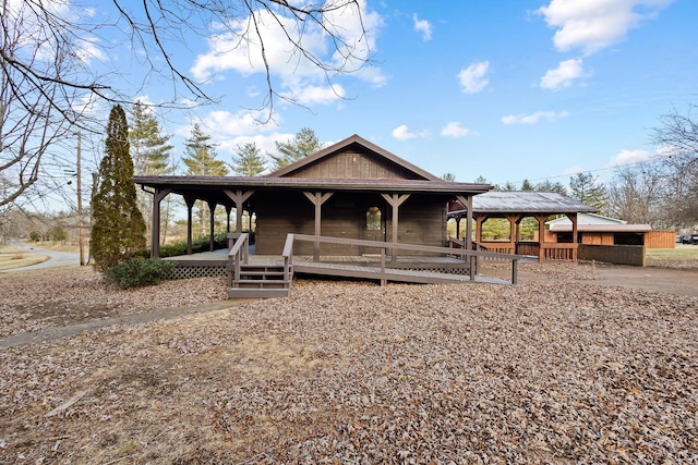 farmhouse inspired home with a porch and a gazebo