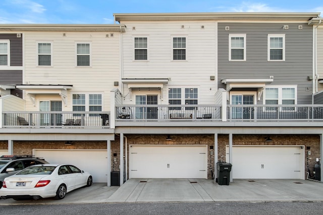 back of property featuring a garage