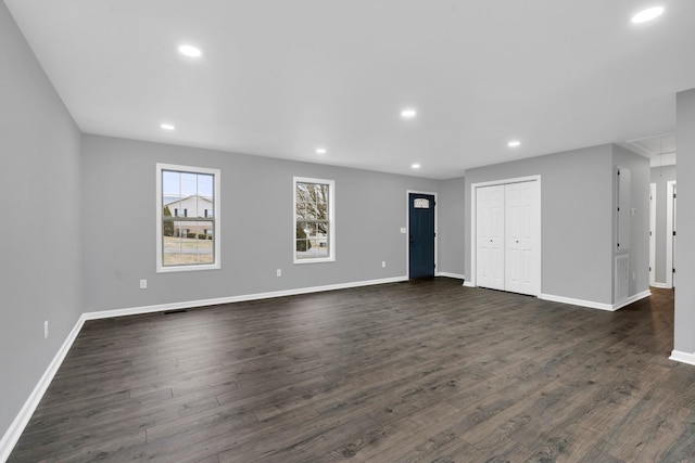 spare room featuring dark wood-type flooring