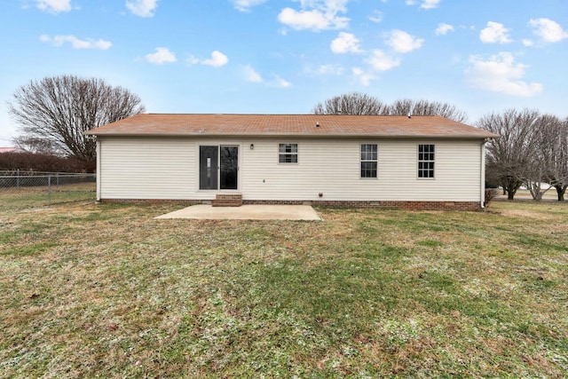 back of property featuring a yard and a patio